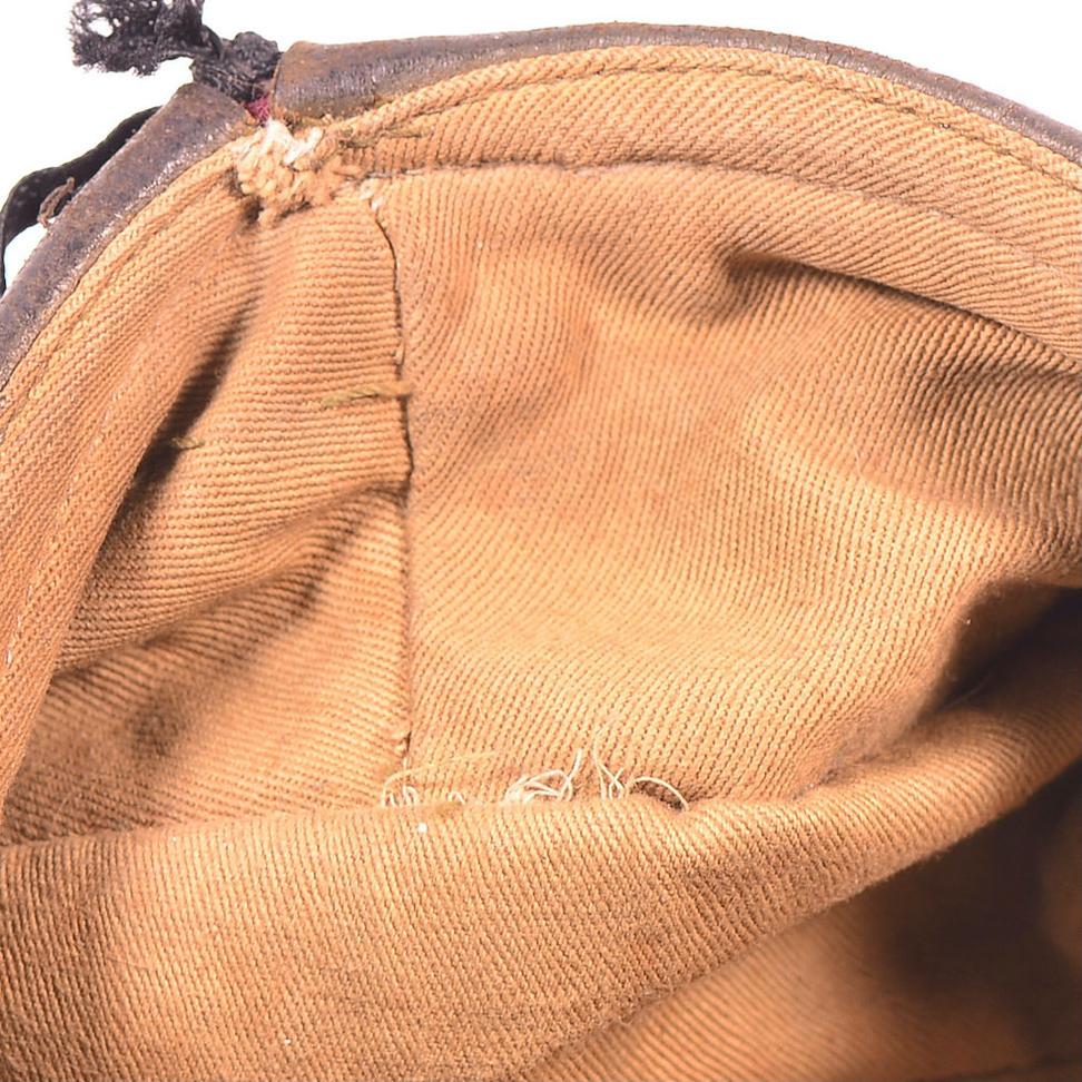 British WWII era soldiers generally did not wear berets into combat instead of their helmets. The standard combat headgear for most British infantry was the Brodie helmet, designed to provide protection on the battlefield.