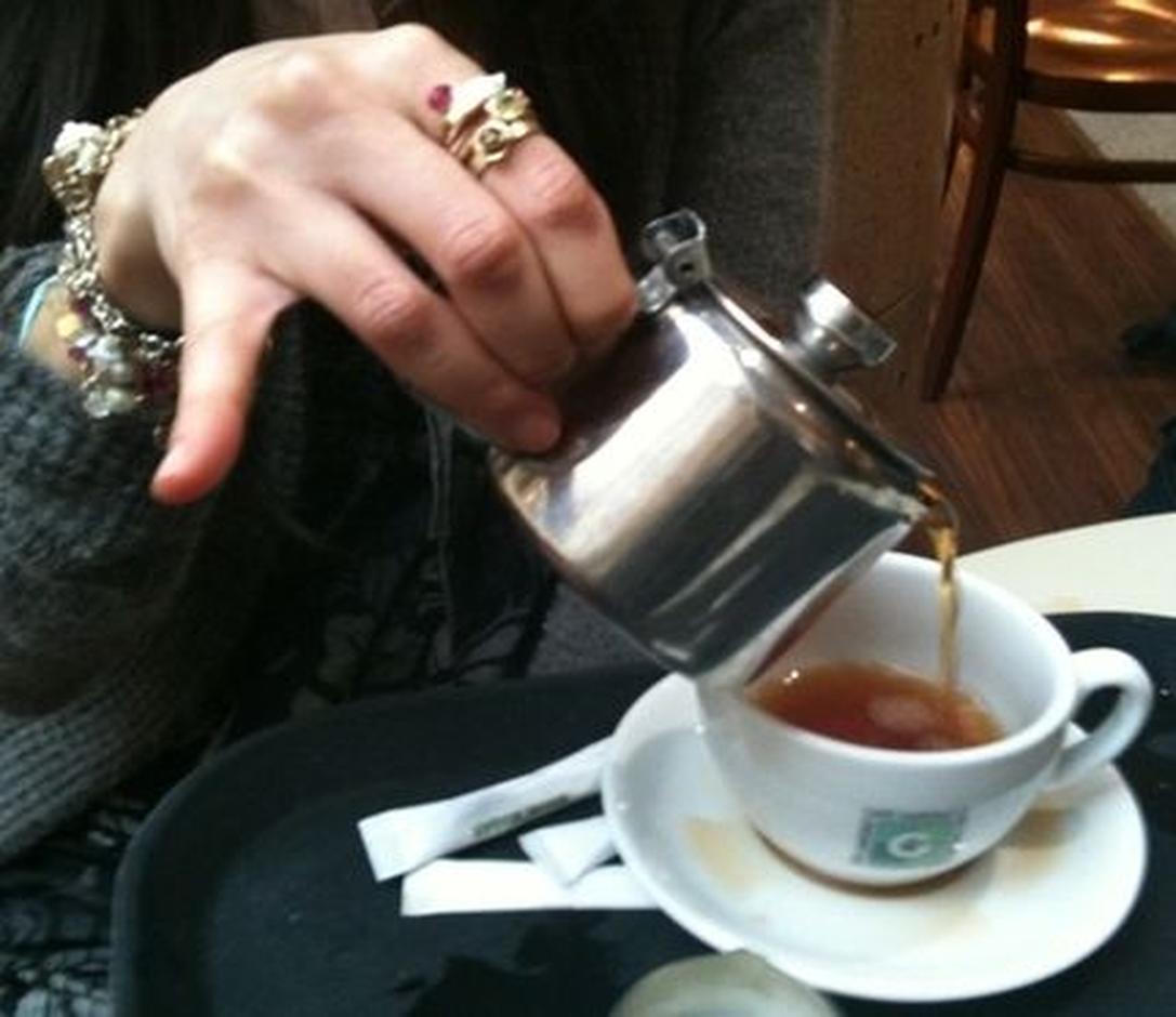 Sticking the pinky finger out when drinking tea has uncertain origins but is often linked to historical dining etiquette.This gesture likely evolved from social customs during the Late Middle Ages and Renaissance, especially among European aristocracy. Although definitive evidence is scarce, scholars suggest the habit relates to dining practices and manners of handling shared food and drink.