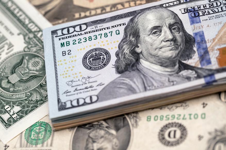 Why does the dollar sign ($) look the way it does? Why does it look like an s, when there is no s in the word dollar?