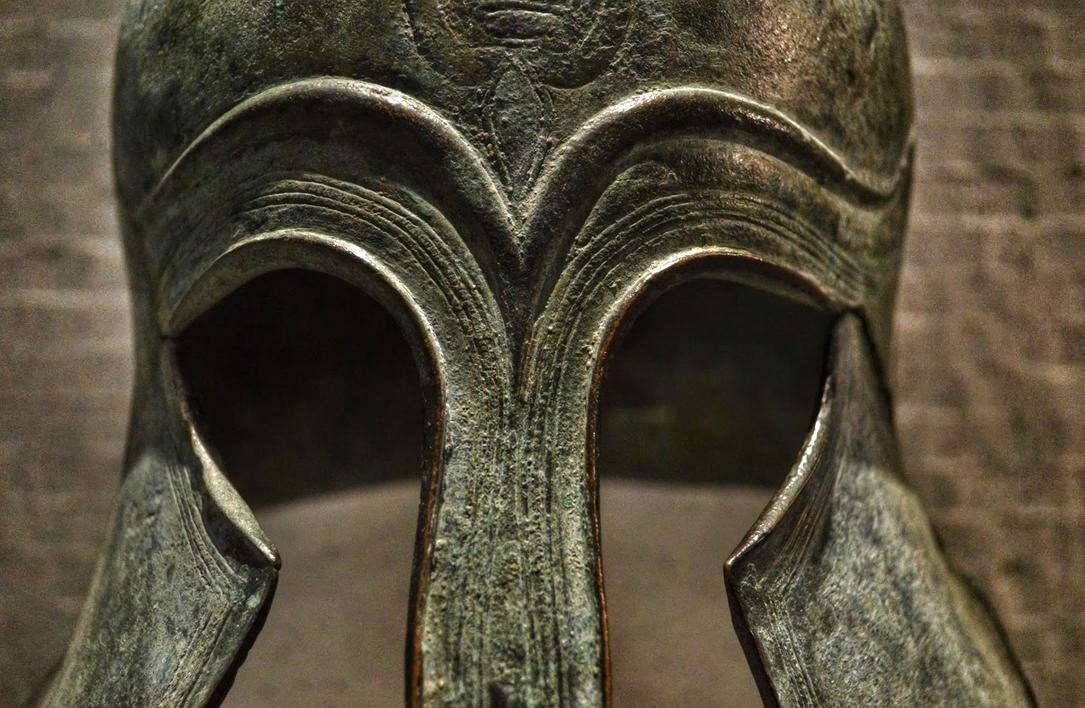 During the Archaic period, the Corinthian helmet enjoyed widespread use. Many examples have been found dedicated at the Panhellenic sanctuary of Olympia, highlighting its cultural and religious significance. Over time, craftwork on these helmets became more elaborate. Late Archaic helmets often featured ridges along the skull and raised lines symbolizing eyebrows above the eye slits. A well-preserved example housed at the Staatliche Antikensammlungen in Munich shows these decorative features clearly.