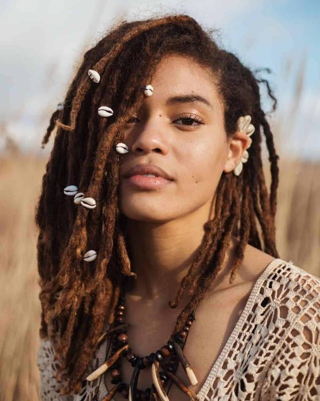 By 1975, dreadlocks were closely associated with Rastafarians, described as long, matted wool-like ringlets or plaits. A transition from exotic warrior styles to a recognized cultural symbol was in full swing.