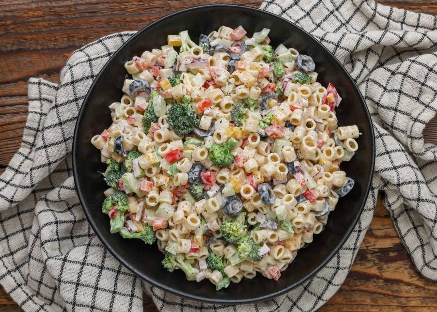 In the song "Yankee Doodle," the word "macaroni" refers to a fashionable and extravagant style associated with certain young British men of the 18th century, who were known as "Macaronis." These men adopted continental European fashions and manners that were seen as excessive and effeminate by their contemporaries. The term "macaroni" in the song mocks the idea that merely adding a feather to a hat would make a person stylish or sophisticated enough to be a true macaroni.