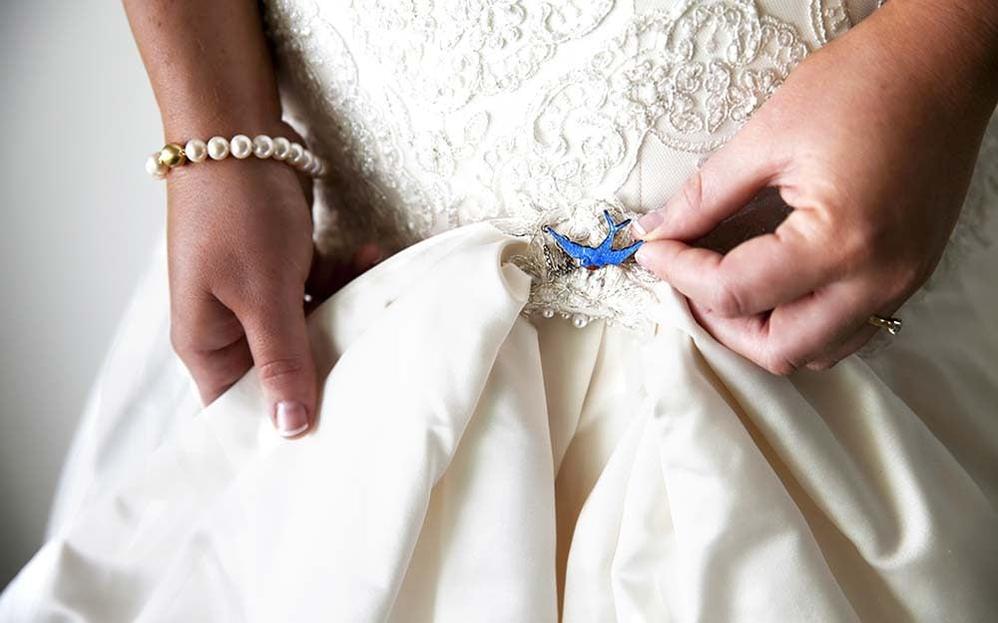 The "something old" represents continuity. It’s a tangible tie to the bride’s family and her past life. Wearing or carrying something old connects the bride to her heritage and ancestral lineage. This might be Grandma’s necklace or a vintage lace handkerchief—something that whispers stories of love and resilience from generations before. Think of it as a lucky charm packed with family vibes. It reminds the bride that even as she steps into a new chapter, her past remains part of her journey.