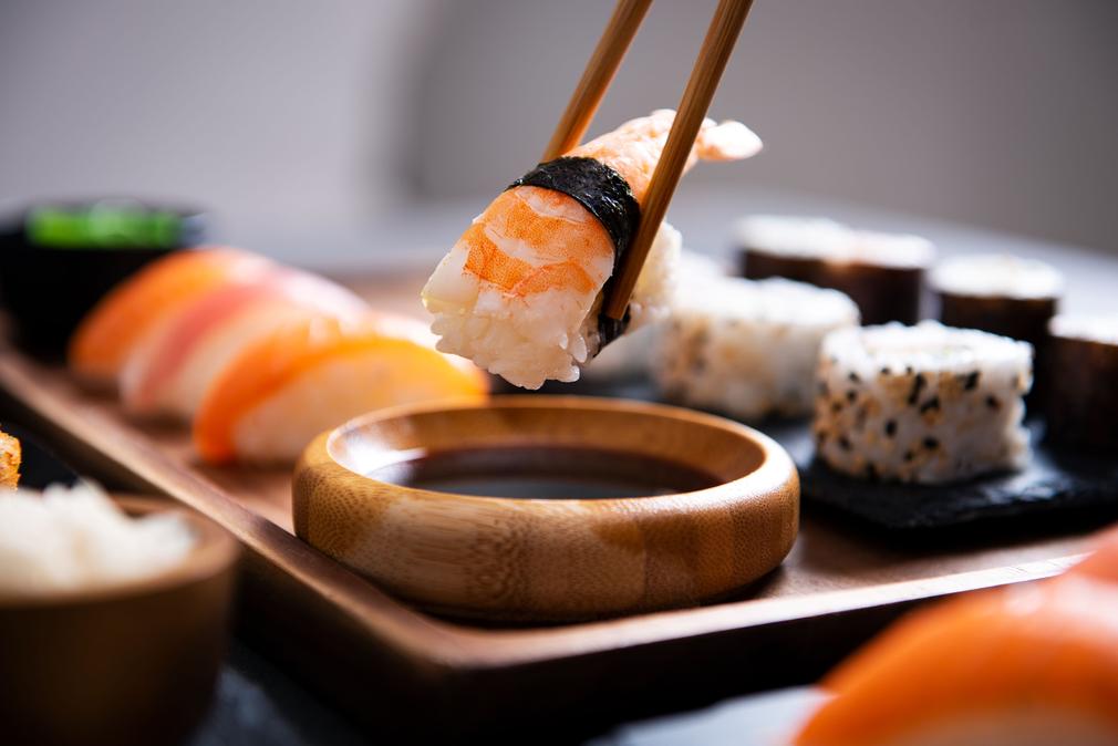The introduction of sushi to Japan dates back to the Nara Period (8th century), where it was noted as an imperial tribute. Initially, the rice fermenting process meant the rice was discarded due to its strong sourness. By the 14th century, Japanese cooks reduced fermentation time, allowing rice to be eaten with fish. This style, called funazushi in Shiga Province, and other narezushi varieties, remain traditional delicacies.