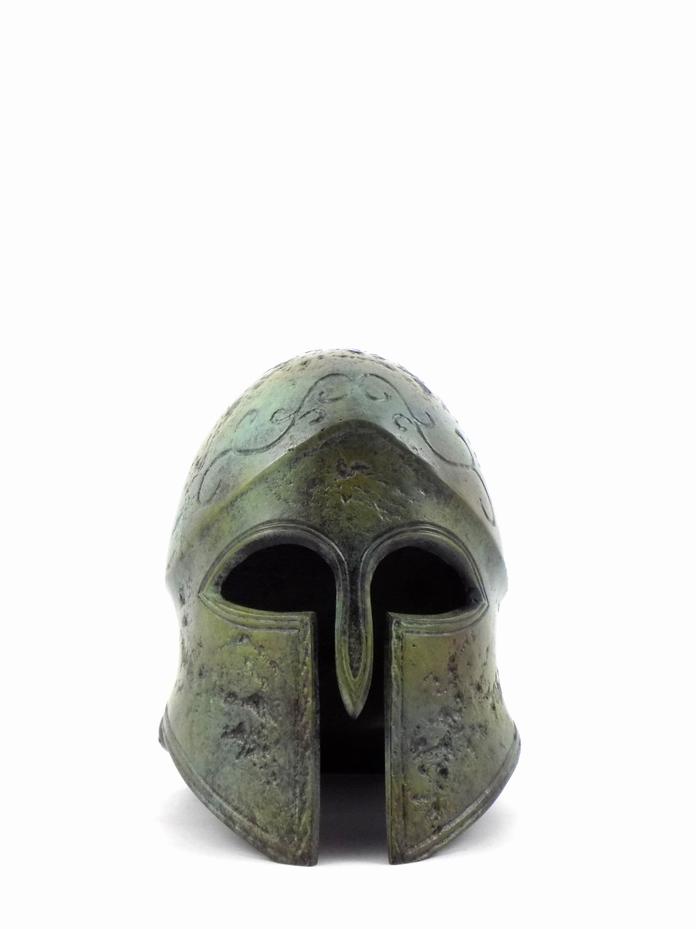 The Corinthian helmet is a type of ancient Greek helmet that first emerges at the end of the eighth century BC. It is known for enclosing the entire head and face, leaving only narrow slits for the eyes and mouth. Made from a single sheet of bronze, it became the most popular Greek helmet throughout the Archaic period (approximately 800 to 500 BC), deeply associated with hoplite warriors and their panoply.